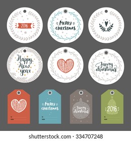 Set of Christmas and New year tags with hand drawn lettering and holiday decoration elements. Xmas gift tags on gray background
