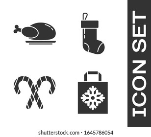 Set Christmas paper shopping bag, Roasted turkey or chicken, Christmas candy cane with stripes and Christmas stocking icon. Vector
