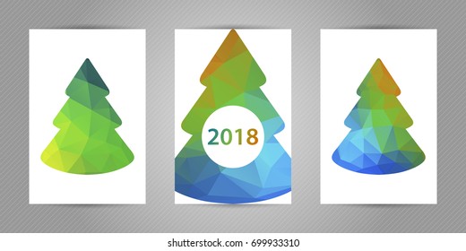 Set of christmas postcards with minimalistic geometric fir tree with colorful green, blue and yellow polygons texture and 2018 numbers.