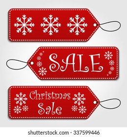 Set of christmas sale tags. Winter style gift and price tags with white snowflake design, hangers and custom text.