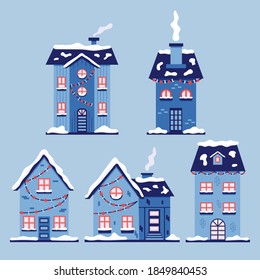 Set of christmas snowy houses. Blue new year vector houses in flat style