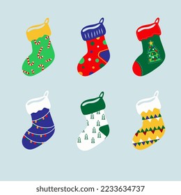 A set of Christmas socks in different colors with a variety of prints