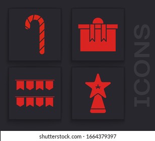 Set Christmas star, Christmas candy cane with stripes, Gift box and Carnival garland with flags icon. Vector