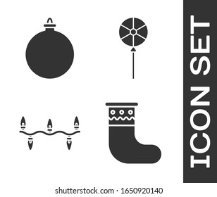 Set Christmas stocking, Christmas ball, Christmas lights and Lollipop icon. Vector