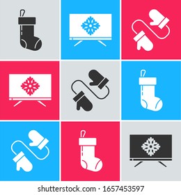 Set Christmas stocking, Merry Christmas on television and Pair of knitted christmas mittens icon. Vector
