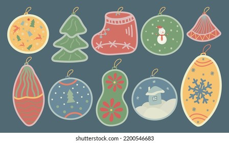 A set of Christmas toys in the form of a ball, an icicle, an oval, a fir tree, a gift, a sock for interior decoration, postcards. Blue background. Isolated vector illustration. Cartoon style