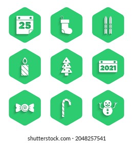 Set Christmas tree, candy cane, snowman, Calendar, Candy, Burning candle, Ski sticks and  icon. Vector