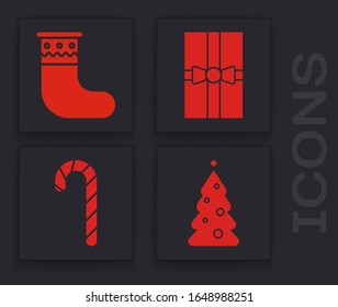 Set Christmas tree with decorations, Christmas stocking, Gift box and Christmas candy cane with stripes icon. Vector