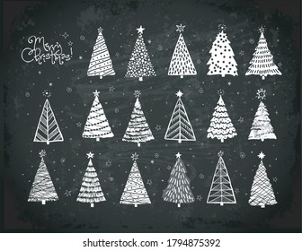 Set of christmas tree doodles hand drawn with white chalks on blackboard background