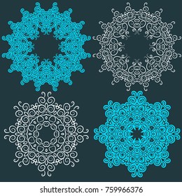 Set of circular blue pattern or snowflake with hand drawn swirls and spirals