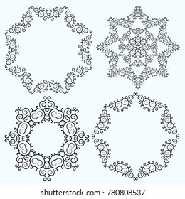Set of circular blue pattern or snowflake with hand drawn swirls and spirals