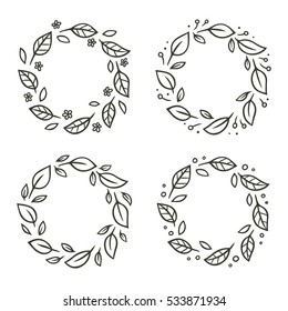 Set of circular leaf wreaths with flowers. Hand drawn vector floral ornament.