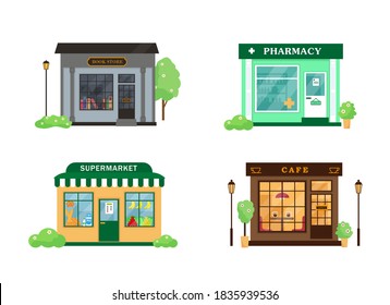 Set of city buildings. Book store, cafe, pharmacy and supermarket exterior. Vector illustrations isolatad on white background.