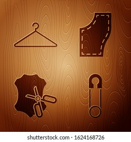 Set Classic closed steel safety pin, Hanger wardrobe, Scissors and leather and Sewing Pattern on wooden background. Vector