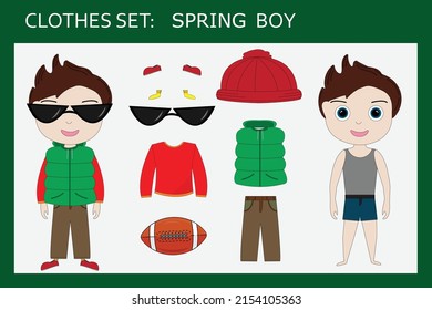Ein Kleiderset für einen kleinen fröhlichen Jungen im Frühling: Pullover, Hose, Weste, Hut, Turnschuhe, Sonnenbrille. Ausstattung eines Kindes im Frühjahr
