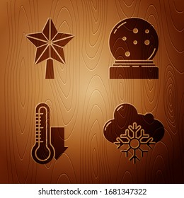 Set Cloud with snow, Christmas star, Meteorology thermometer measuring and Christmas snow globe with fallen snow on wooden background. Vector