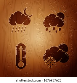 Set Cloud with snow and sun, Cloud with rain and moon, Thermometer and Cloud with rain and sun on wooden background. Vector