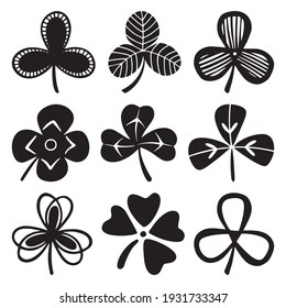 Set of clover or trefoil or shamrock leaves, St Patrick Day symbol. Silhouette vector illustrations isolated on the white background.