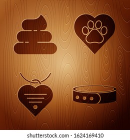 Set Collar with name tag, Shit, Collar with name tag and heart and Heart with animals footprint on wooden background. Vector