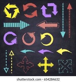 Set of  color chalk hand drawn arrows. Black chalkboard background.