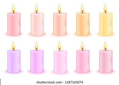 Set of color cylindrical candles with burning flames.