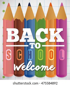 Set of color pencils commemorating this Back to School season over a notebook paper.