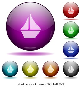 Set of color sailboat glass sphere buttons with shadows.