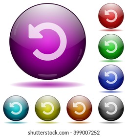 Set of color Undo changes glass sphere buttons with shadows.
