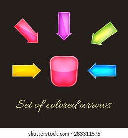 Set of colored glass arrows on dark background