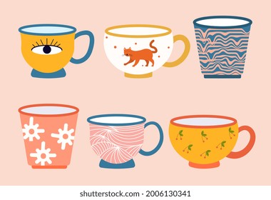 Set of colored mugs. Beautiful modern cups for hot drinks with abstract patterns. Trendy tableware with drawings for the home. Cartoon flat vector illustration isolated on a pink background
