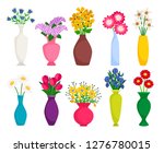 Set of colored vases with blooming flowers for decoration and interior. Chamomile, tulip, poppy and lilac. Vector illustration