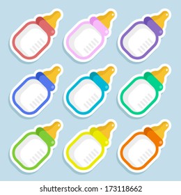 Set of colorful baby milk bottles