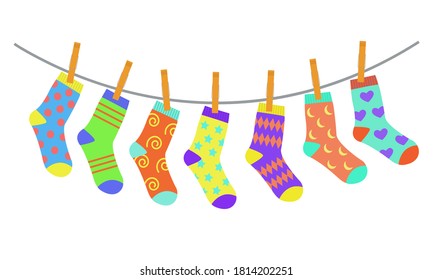 Set of colorful bright children socks drying on the clothesline. Vector illustration in flat style