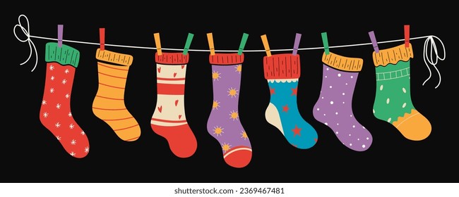 Set of colorful bright children socks with textures and patterns on a rope with colored clothespins. Vector illustration