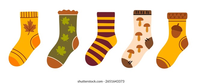 Set of colorful cozy socks decorated with seasonal elements like leaves, mushrooms, stripes and acorns
