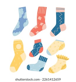 Set of colorful cute socks of different lengths and sizes, with different patterns isolated on white