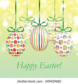 Set of colorful Easter eggs with green ribbons