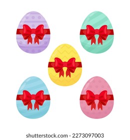 Set von bunten Ostereiern mit roten Schleifen.