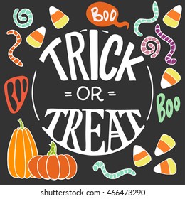 Set of colorful hand drawn halloween doodles with cartoon candy corns, pumpkins, worms and other elements on chalkboard background. Trick or threat hand lettering.