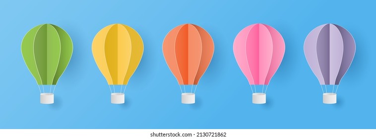 Set of colorful hot air balloons 
on blue sky background. Paper cut style. Vector illustration