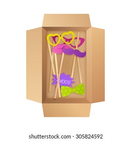 set of colorful photo props in open box 
