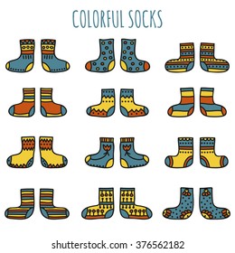 Set of colorful socks with different patterns in desaturated colors on a white background. Vector illustration