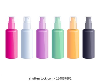 Set of colorful spray bottles on white background.