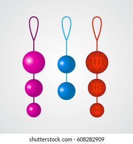 Set of colorful vaginal balls on a grey background