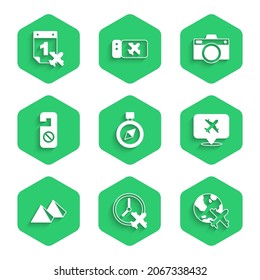 Set Compass, Clock with airplane, Globe flying, Speech bubble, Egypt pyramids, Please do not disturb, Photo camera and Calendar and icon. Vector