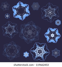 Set consists of different lacy snowflakes on a dark background.