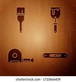 Set Construction bubble level, Paint brush, Roulette construction and Putty knife on wooden background. Vector