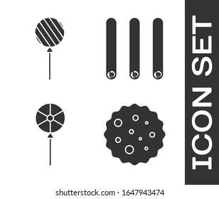 Set Cookie or biscuit with chocolate, Lollipop, Lollipop and Three rolled sticks of cinnamon icon. Vector