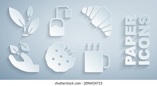 Ponga galletas, croissant, hoja de té en la mano, Taza de té, bolso e ícono. Vector