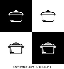 Set Cooking pot icon isolated on black and white background. Boil or stew food symbol.  Vector Illustration